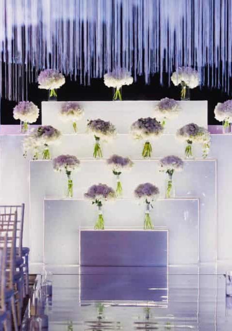 Wedding Ceremony Floral Arrangement White lighting Purple Decor
